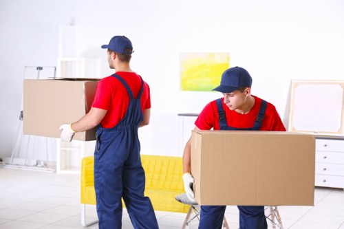 Movers loading furniture into a van