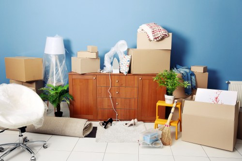 Commercial moving professionals handling office furniture