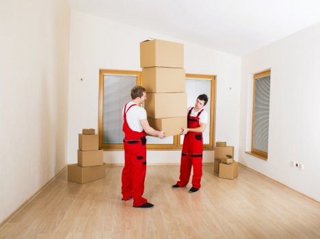 Professional movers loading furniture